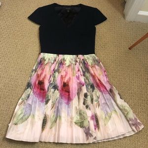 Black top and floral skirt dress